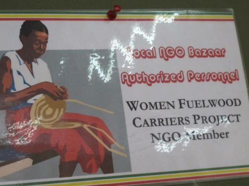 Fuelwood carrier NGO sign